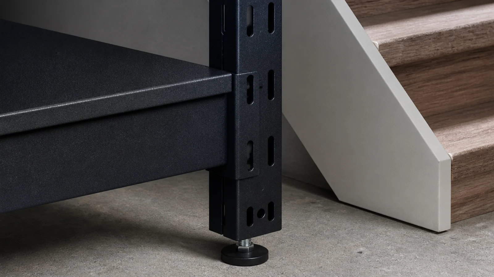 powder coated steel shelving standing against a basement stair wall
