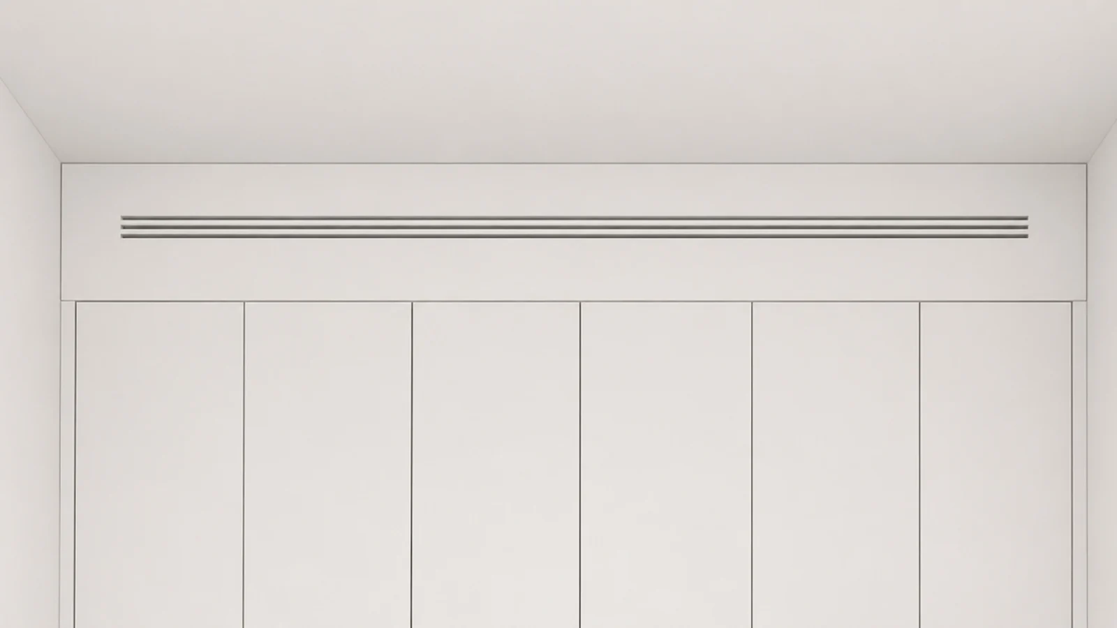 slim linear slot grille painted the wall colour above tall utility cabinets