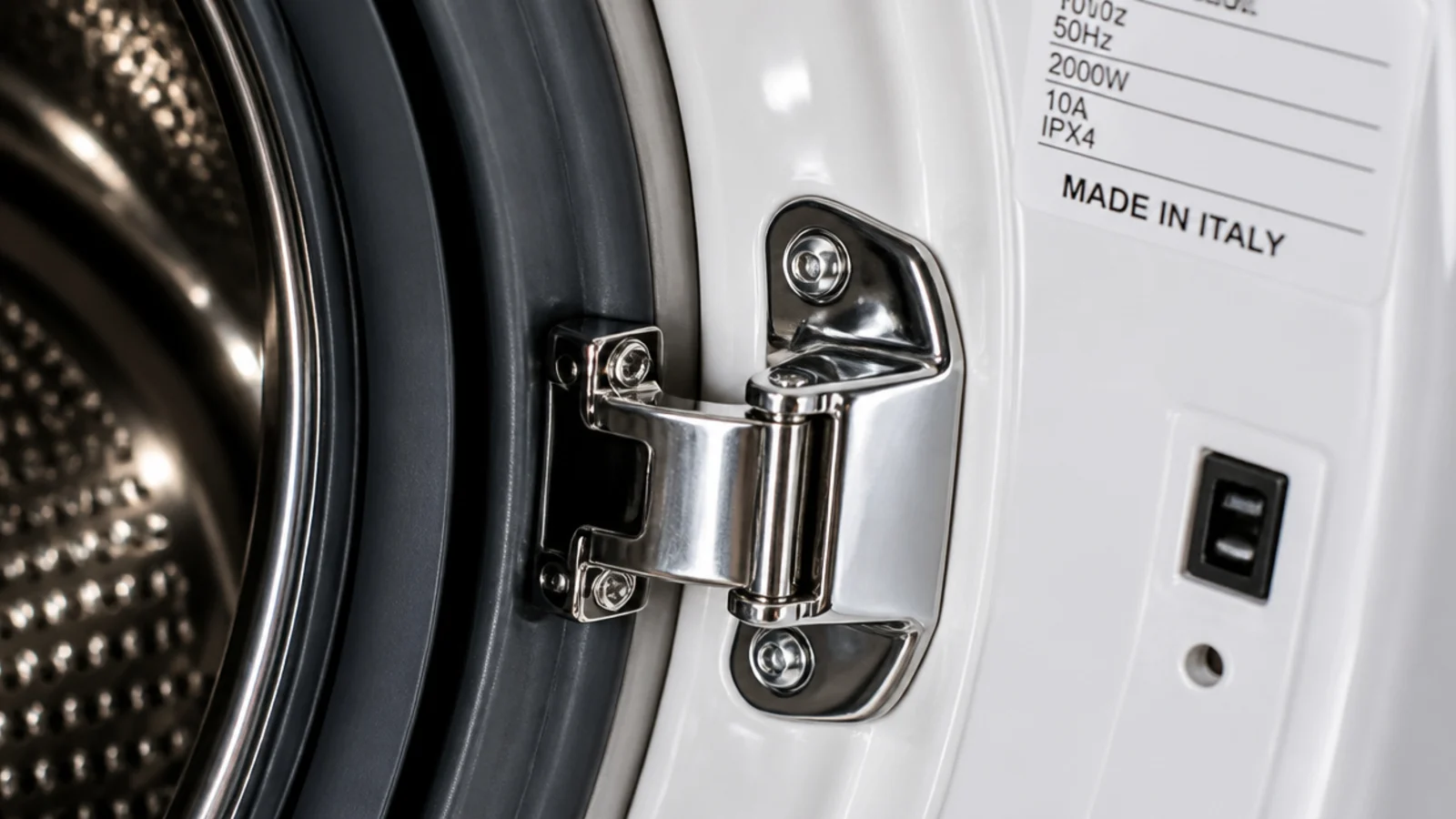 washing machine door hinge and catch shown close against white enamel