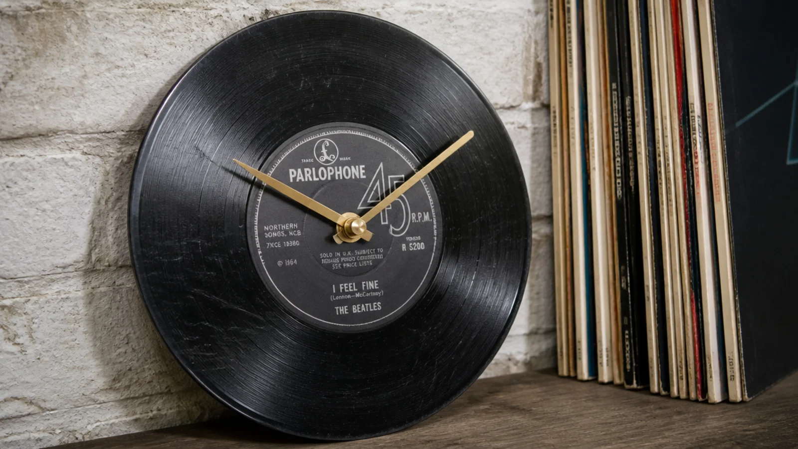 old vinyl record converted into a clock with slim hands