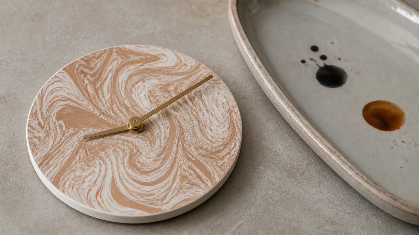 marbled paper disc mounted on card as a swirled clock face