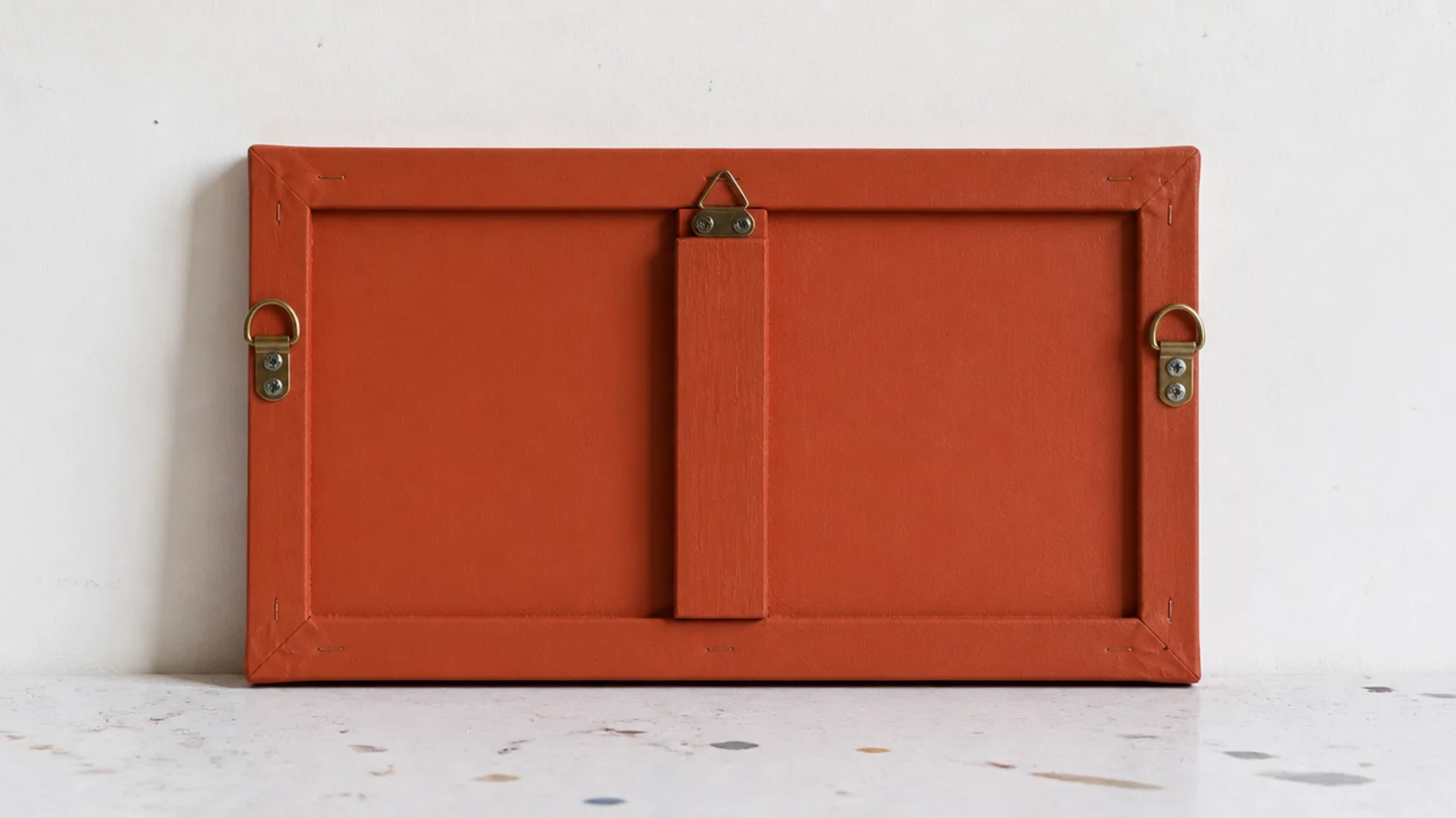 small stretched canvas painted flat and fitted with clock hands