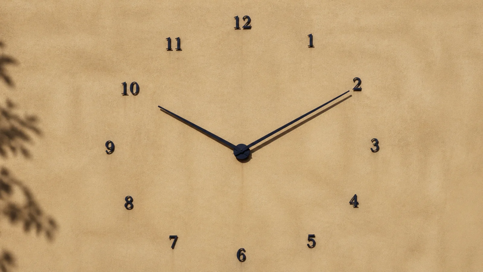 individual oversized numerals fixed in a wide circle on plaster