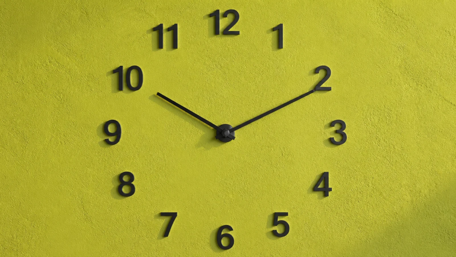 individual metal numerals fixed directly onto a plaster wall