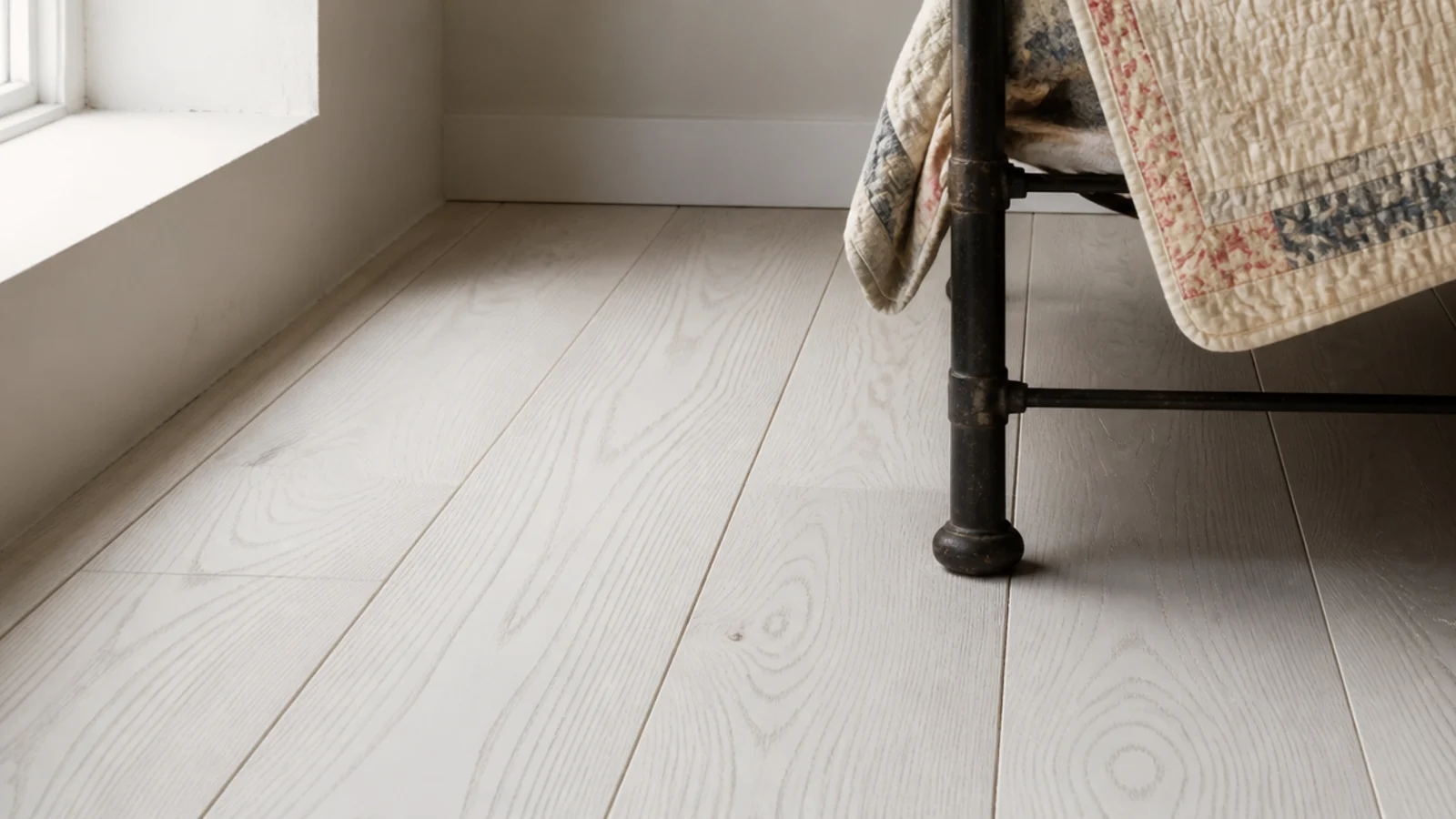 whitewashed pine boards with grain showing through thin white pigment