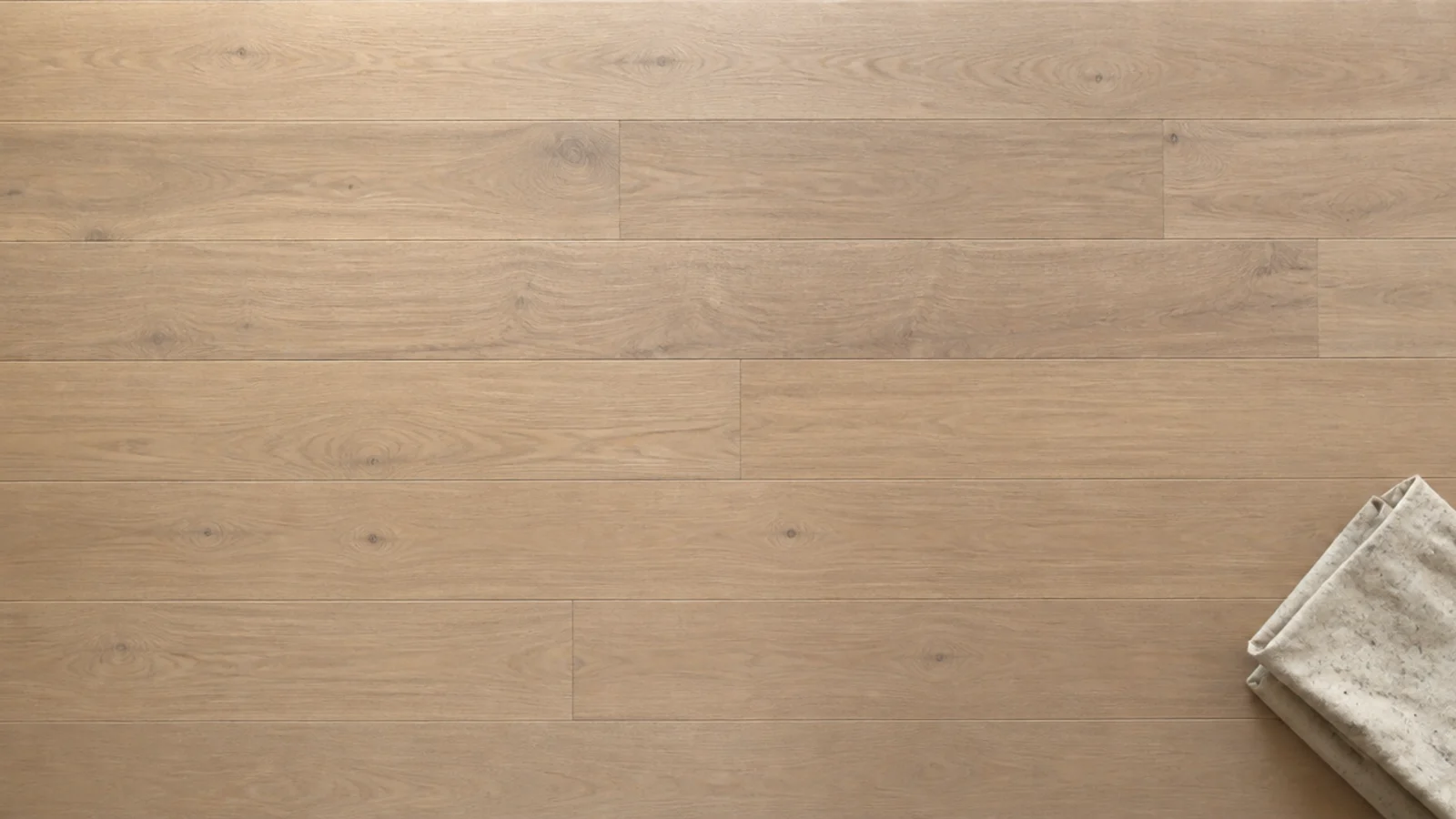 matte finished floorboards refusing to reflect a window above them
